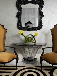 Styled interior mixing modern furniture with vintage antique ceramics and decor