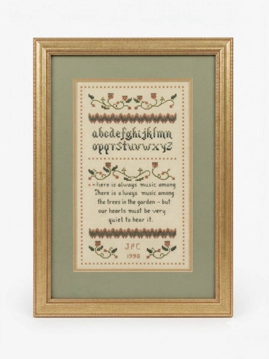 Vintage 1998 cross stitch sampler in gold frame - front view