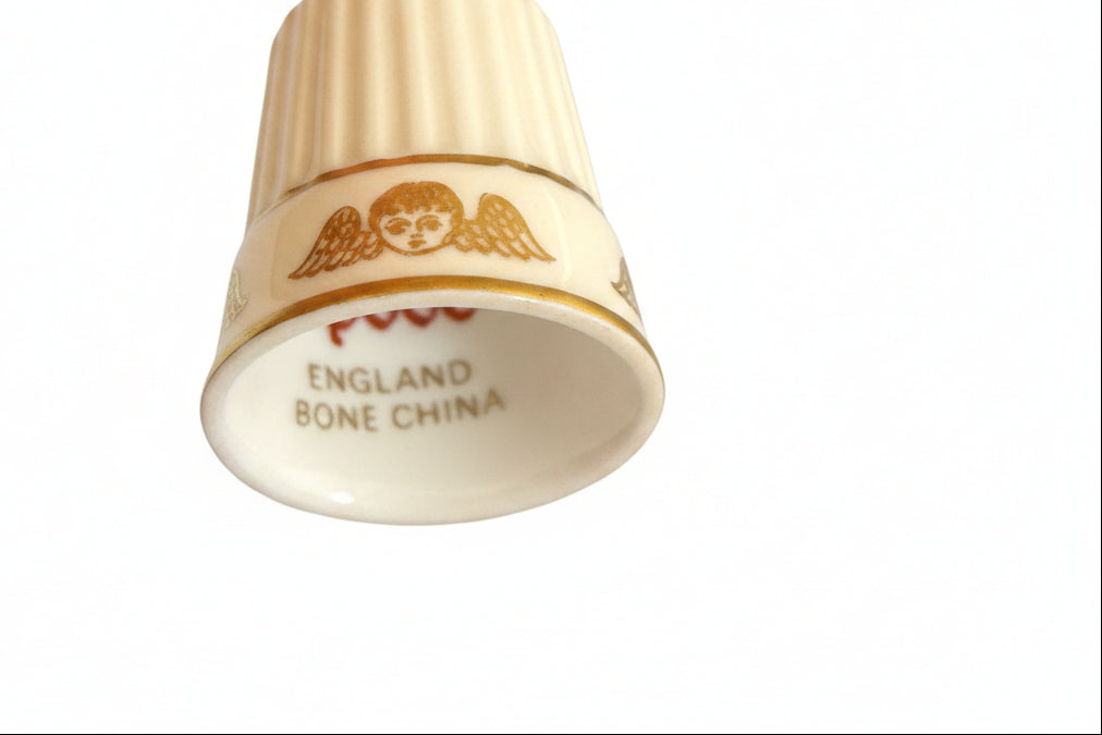 Thimble with Cherub (or Winged Head) Motif and Gold Gilt.|286907698089