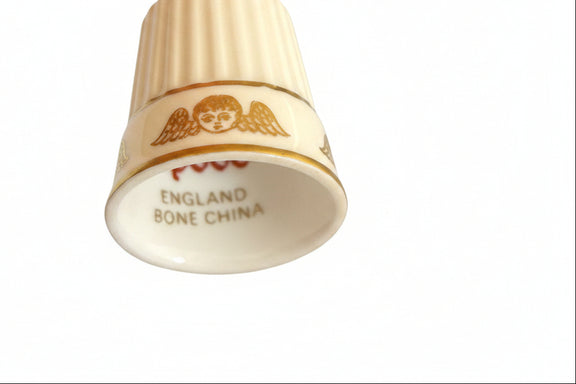 Thimble with Cherub (or Winged Head) Motif and Gold Gilt.|286907698089